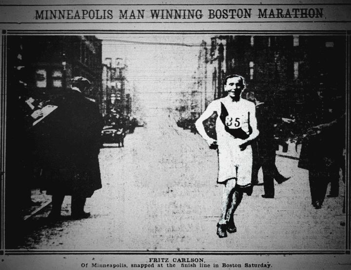 black-and-white photo of a man running in a crowded street