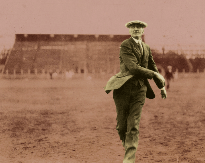 LJ Cooke throwing a football on Northrup Field in the early 1900s.